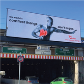 Image of a billboard on a famous overpass in Richmond Australia featuring a big national ambassador campaign.