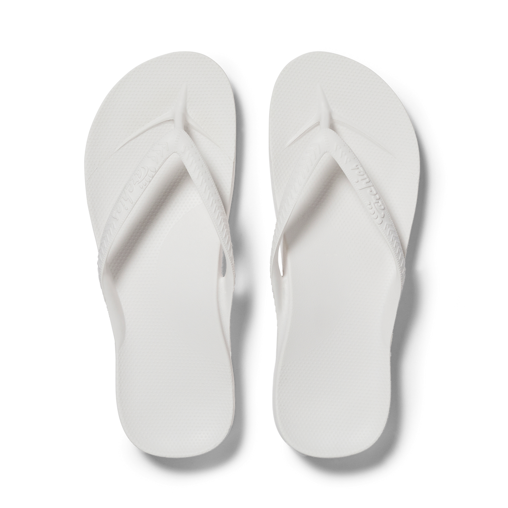 White flip flops with arch deals support